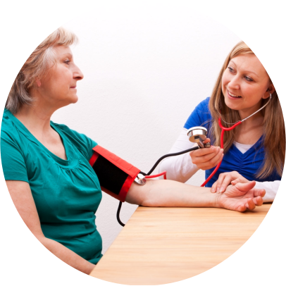 Caregiver taking blood pressure to an Elderly
