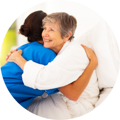 Caregiver hugging to an Elderly