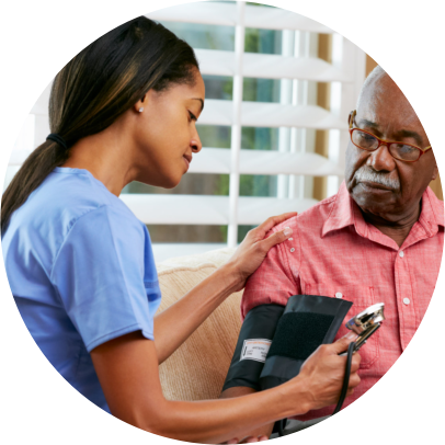 Caregiver taking blood pressure to an Elderly